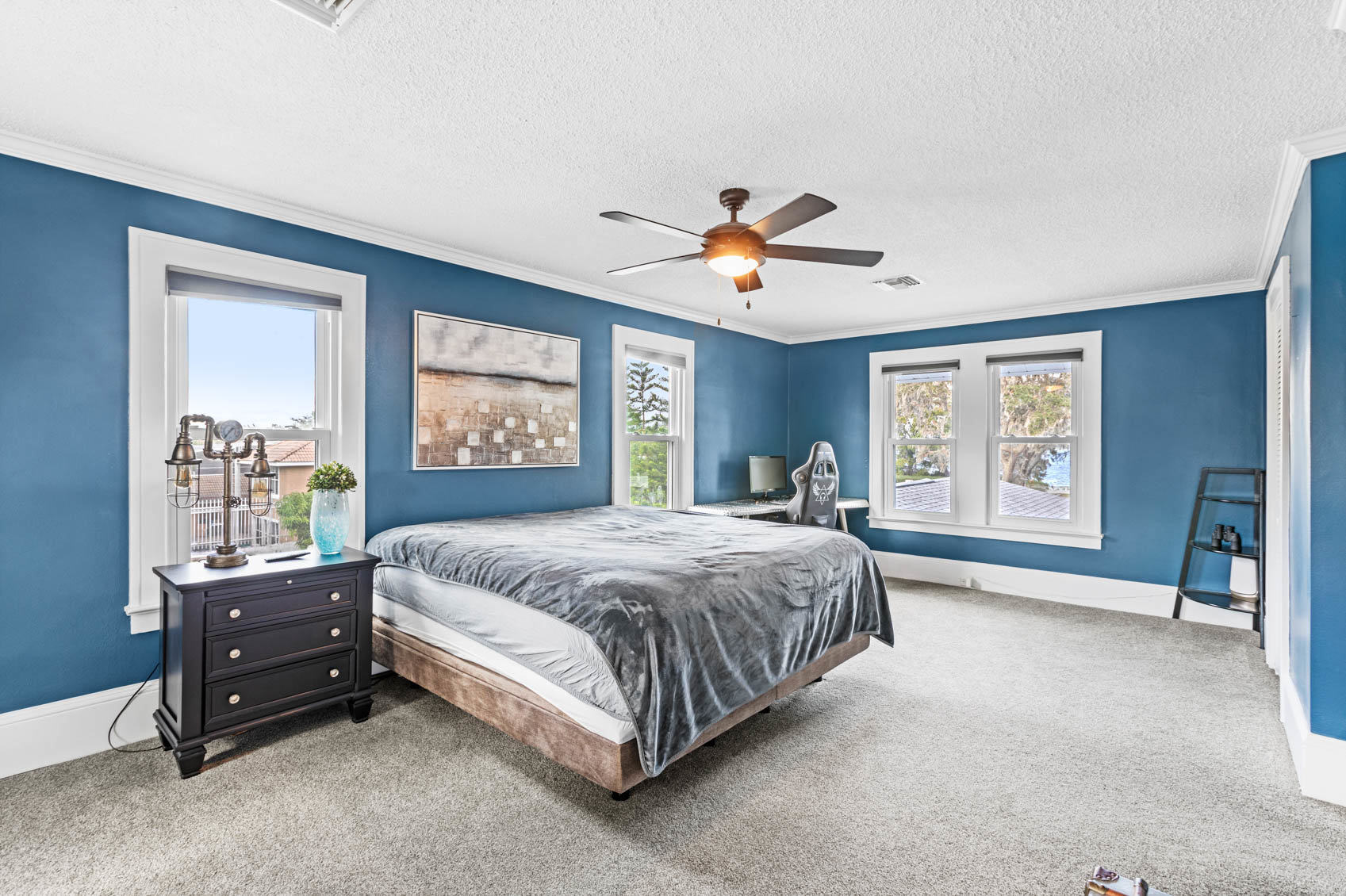 bedroom with blue walls and furniture